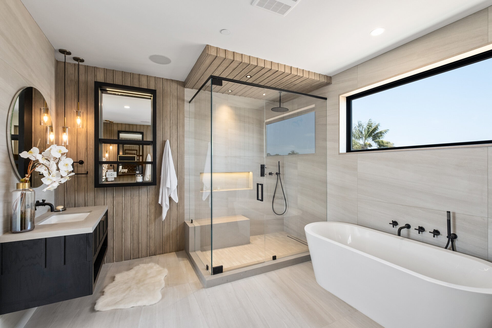 Bathroom with a glass shower and freestanding bath