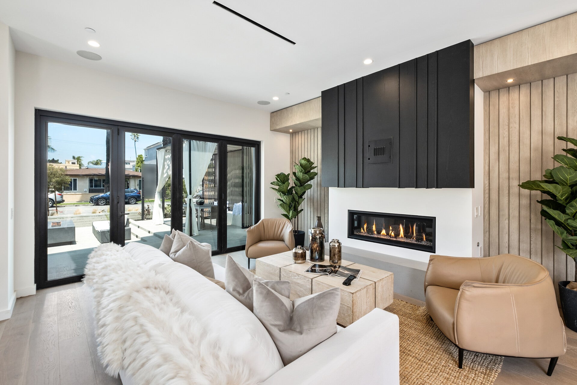 Living room with tall doors opening to the terrace