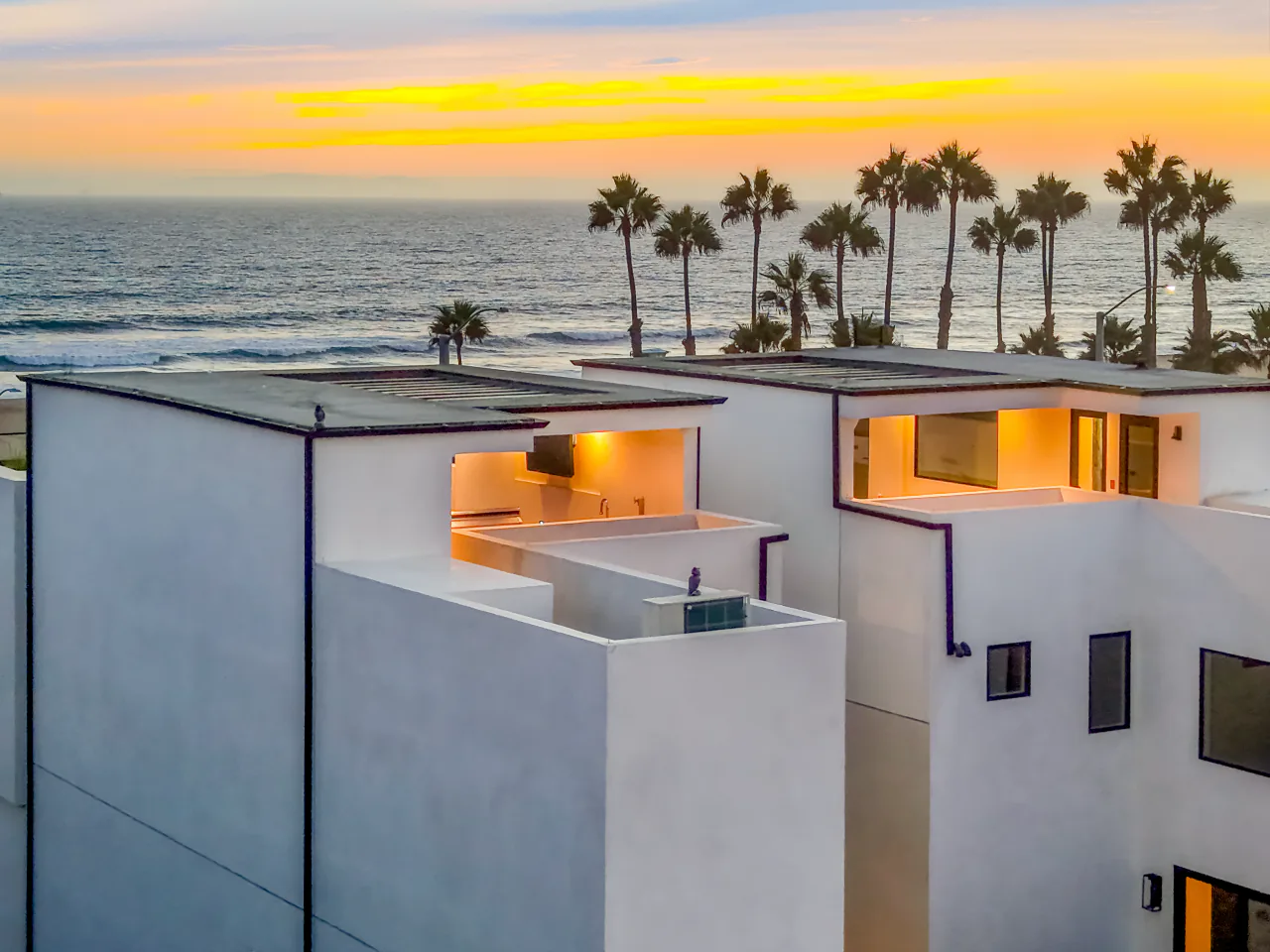 Rooftops and the Pacific at sunset